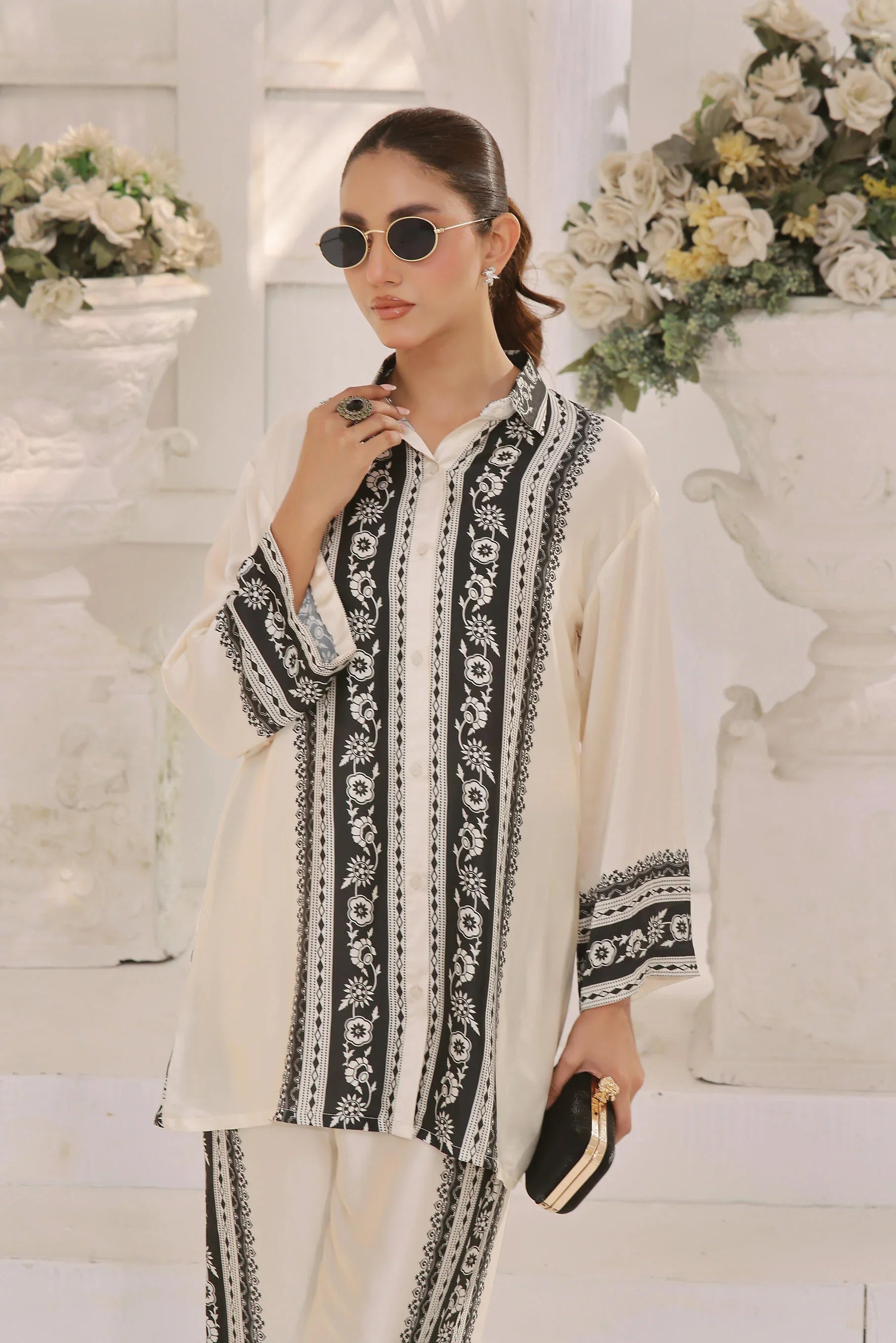 Model displaying a refined black silk co-ord look by Buraqstore