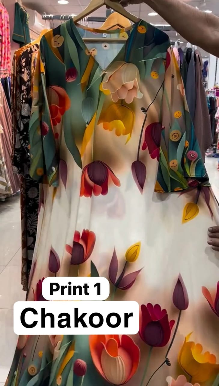Chakoor Print 1 long floral dress featuring large pink and purple tulip patterns on a white background with blue cuff details. 