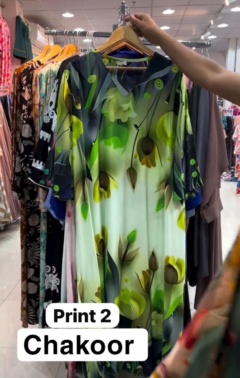 Chakoor Print 2 long floral dress featuring large pink and purple tulip patterns on a white background with blue cuff details.