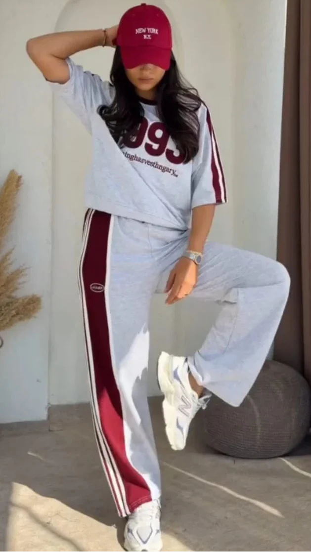Grey 1993 graphic sweatshirt and matching wide-leg track pants set paired with white chunky sneakers 02
