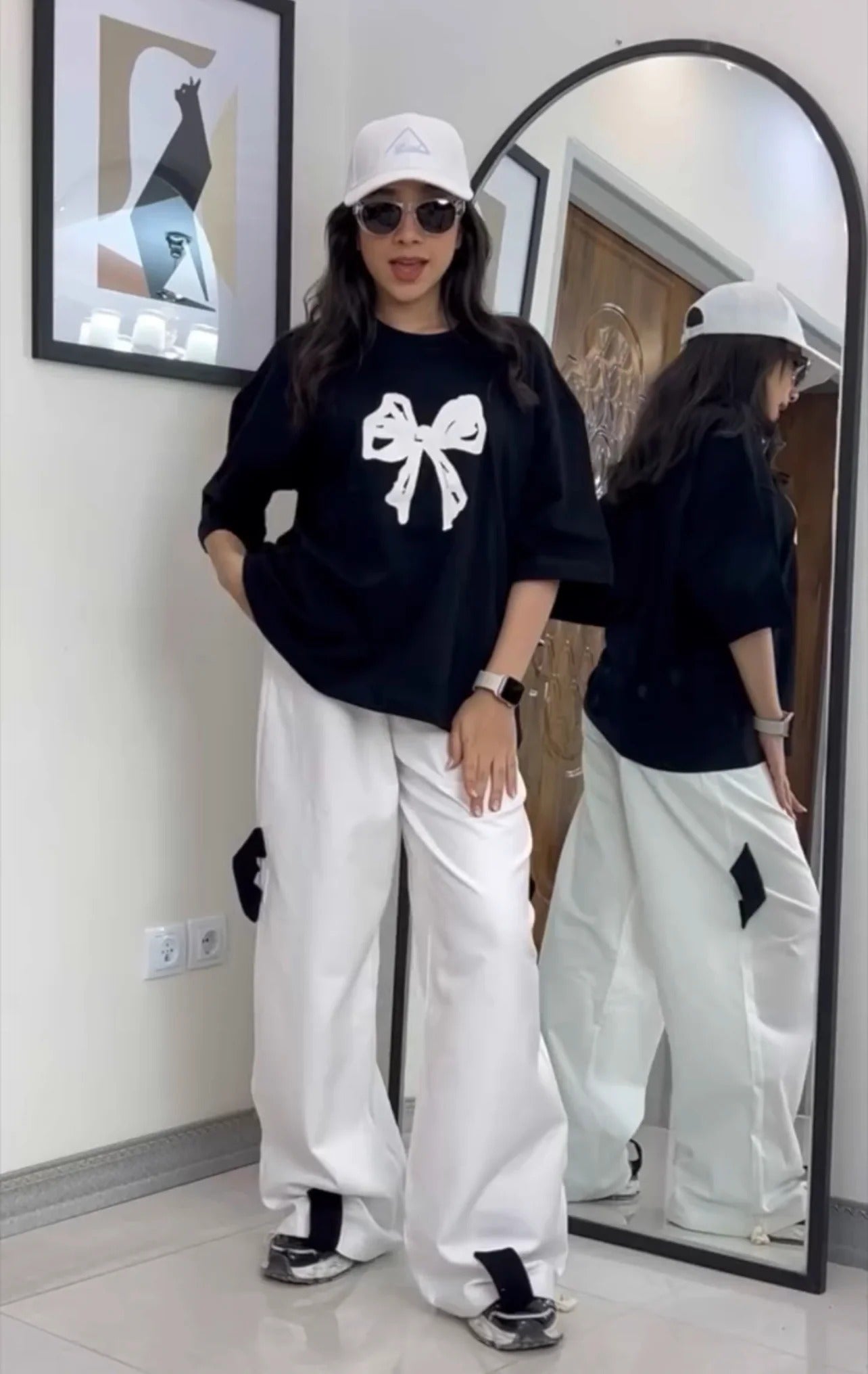 Oversized drop-shoulder t-shirt with a center ribbon bow graphic paired with wide-leg cargo trousers 02
