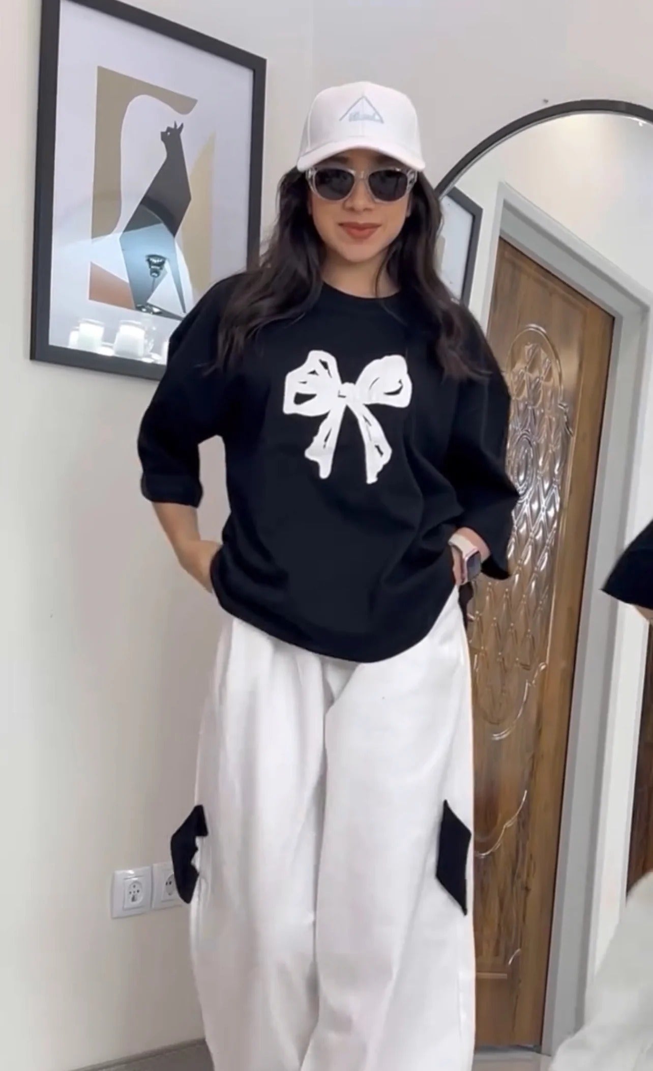 Oversized drop-shoulder t-shirt with a center ribbon bow graphic paired with wide-leg cargo trousers 04