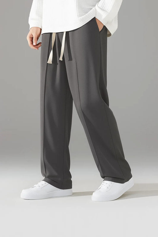 Charcoal Grey men's baggy trousers with a relaxed fit and a contrasting off-white drawstring, perfect for casual wear.