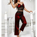 Two-piece satin sleepwear set featuring a lace-trim camisole top and matching straight-leg pajama pants 01