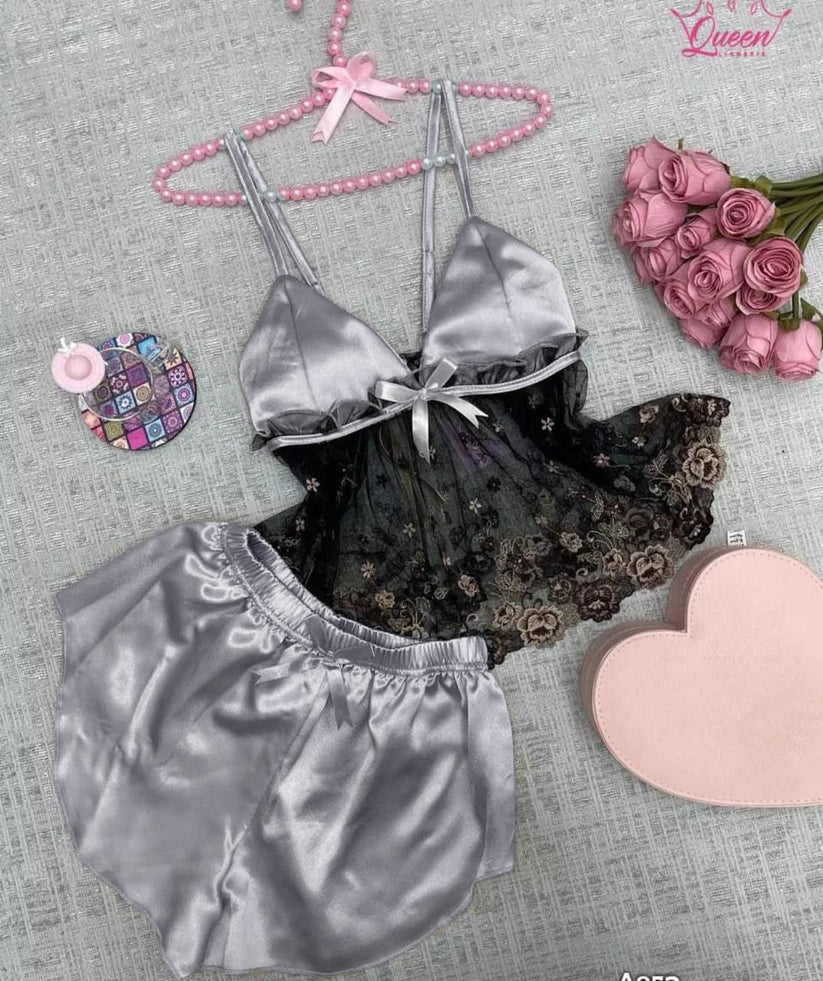 Two-piece satin sleepwear set featuring a lace-trim camisole top with floral embroidery and matching shorts 02