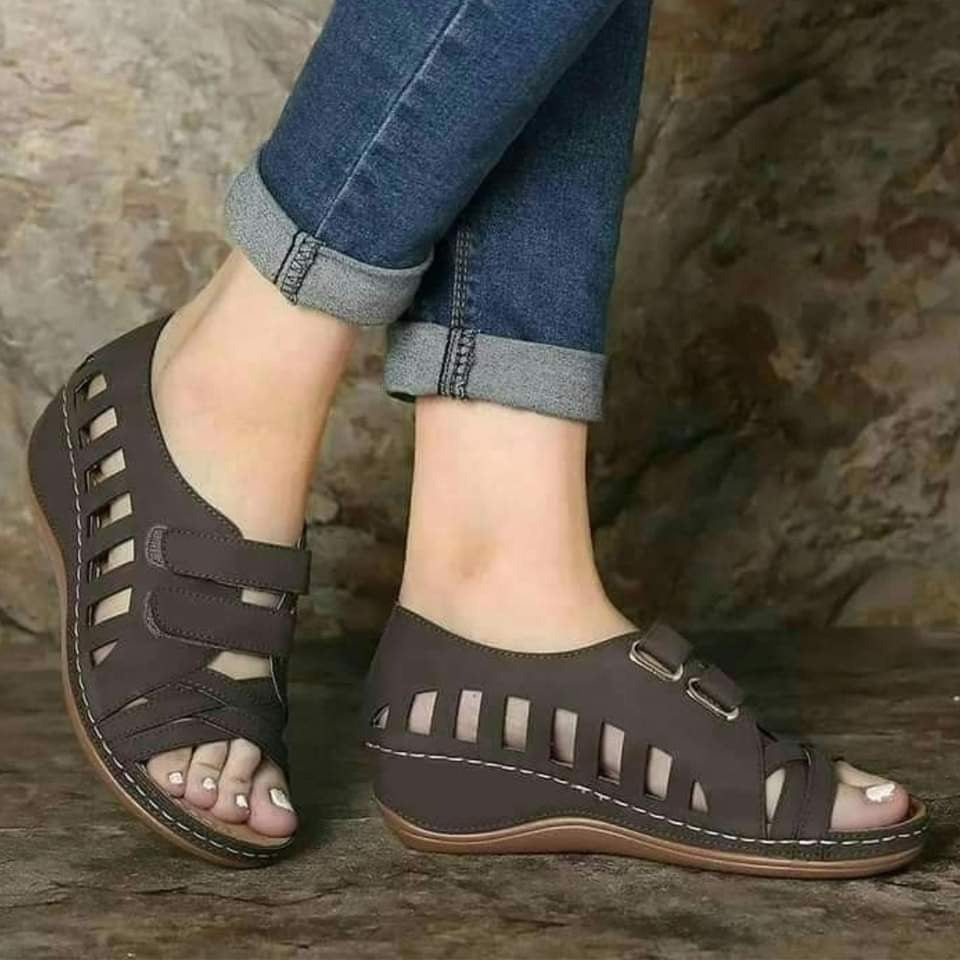 Buckal Wedge Sandals.
