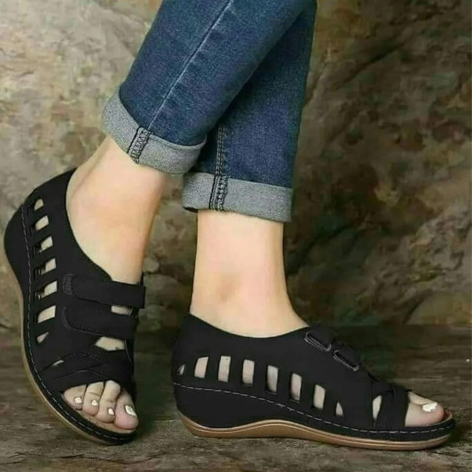 Buckal Wedge Sandals.