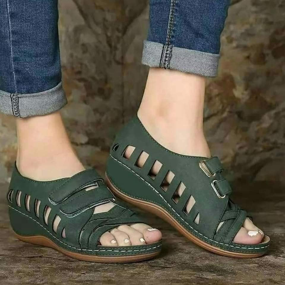 Buckal Wedge Sandals.